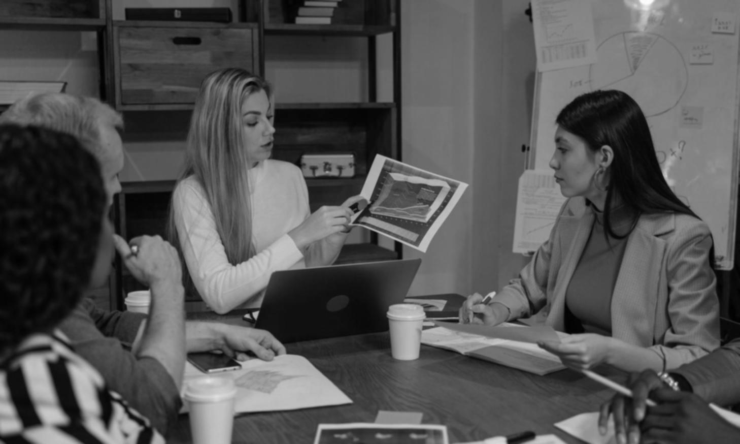 Property valuation specialist reviewing documents at a desk